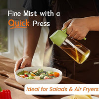 Oil sprayer bottle filled with olive oil on a kitchen counter