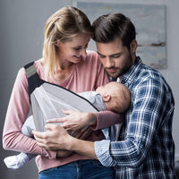 Breathable baby sling carrier shown flat with adjustable strap